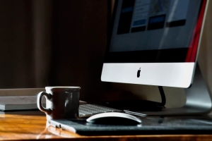 iMac with upgraded RAM and a nice cup of coffee